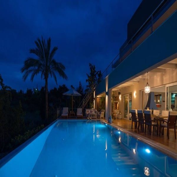 Luxury villa and pool in Greece at dusk